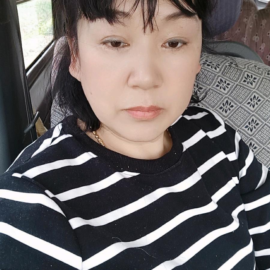 梁少英