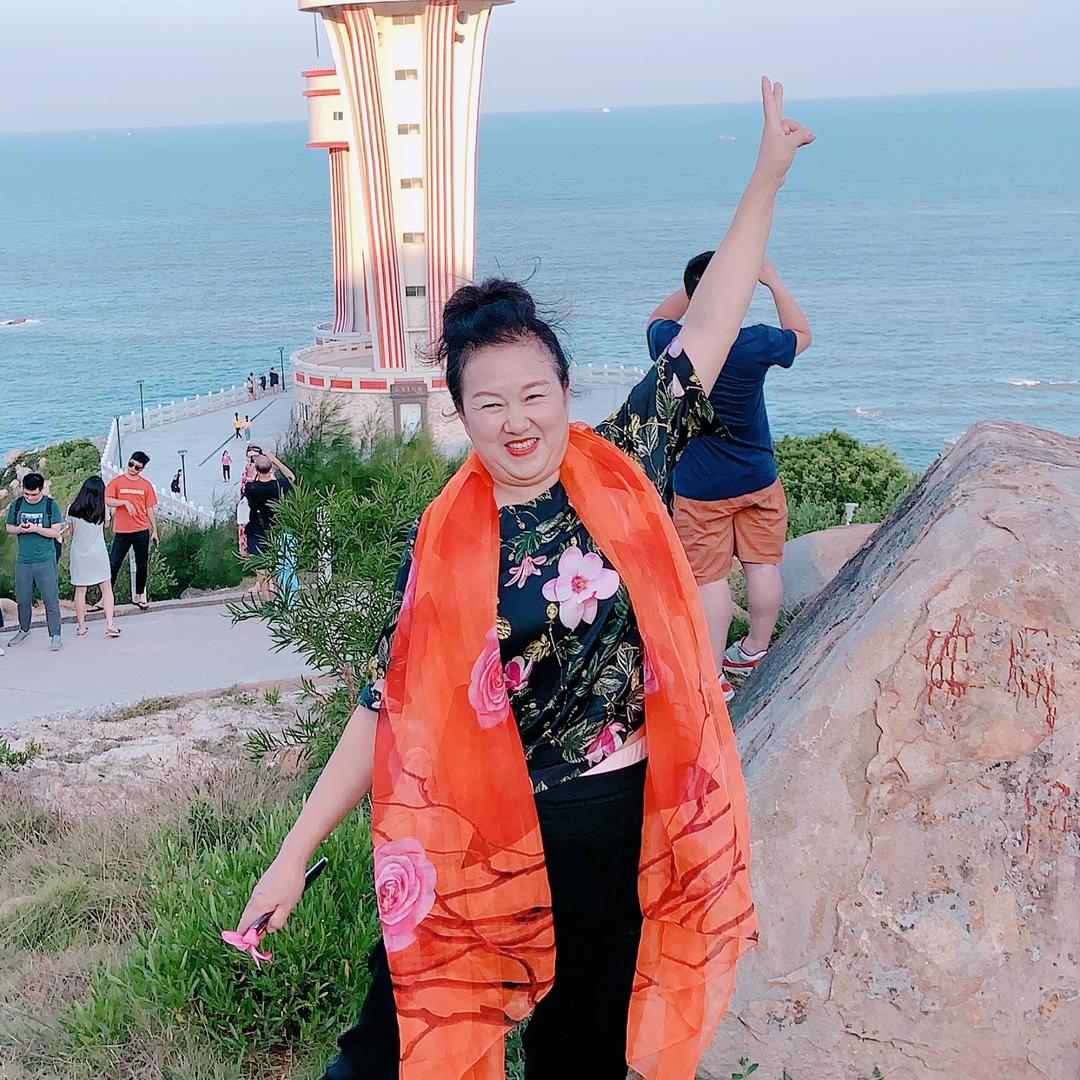 嫣然