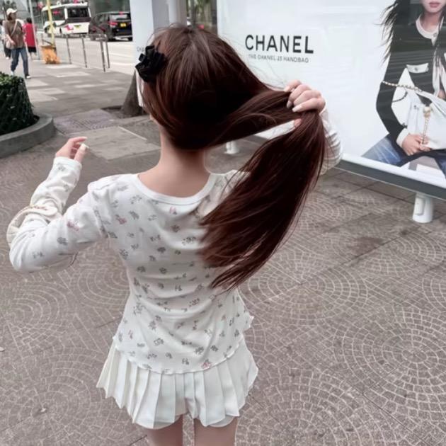 七七