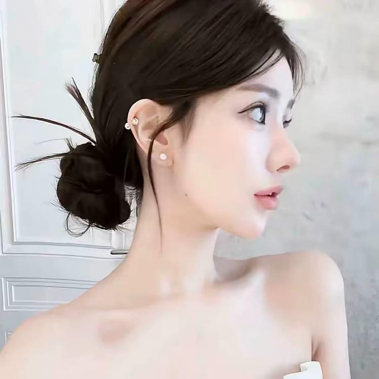 T.