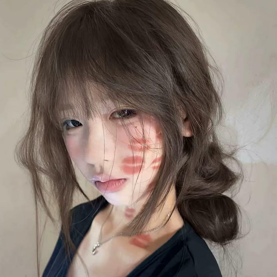 T.
