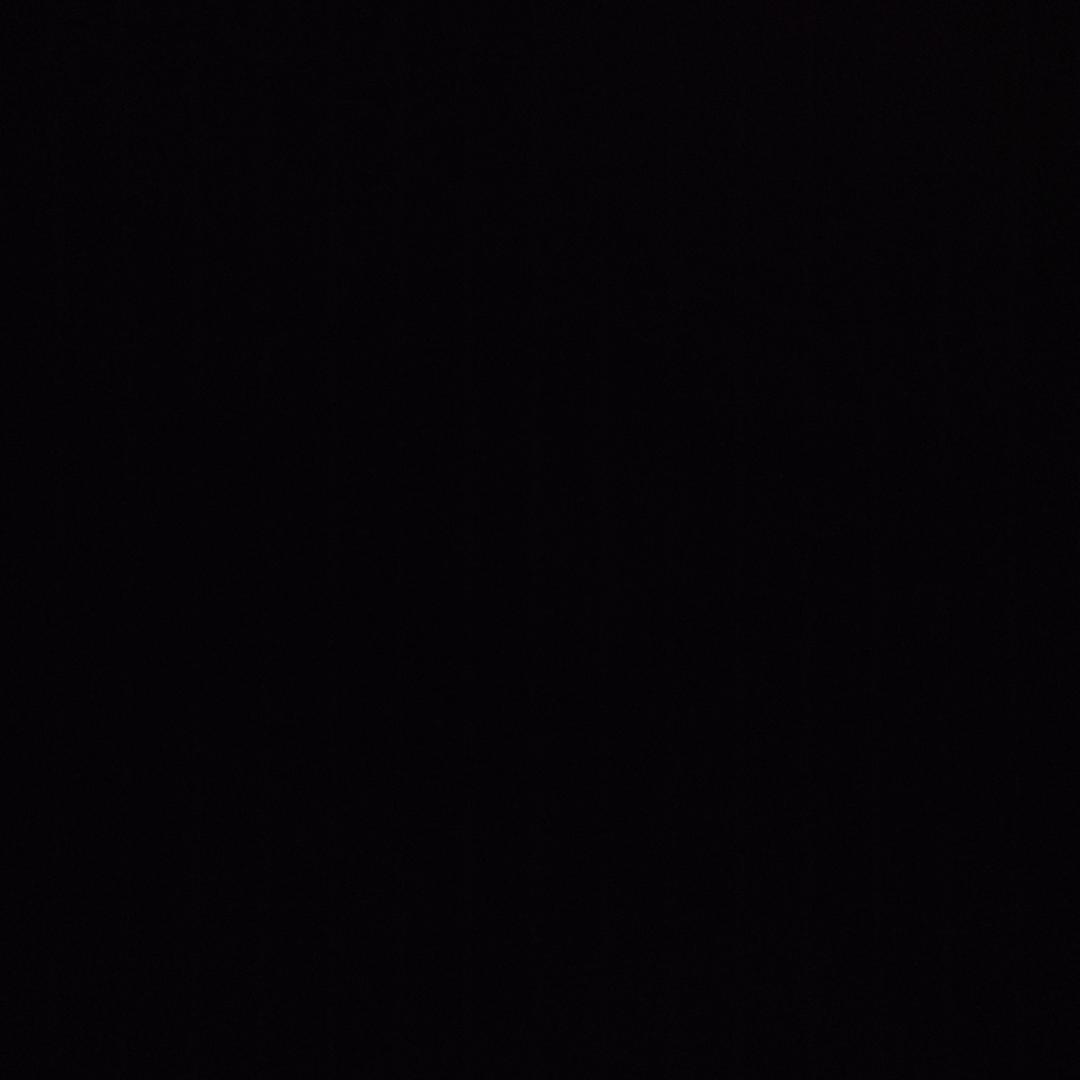T.