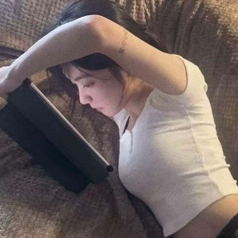 T.
