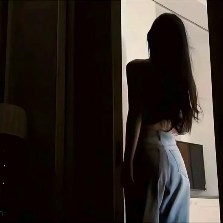 T.