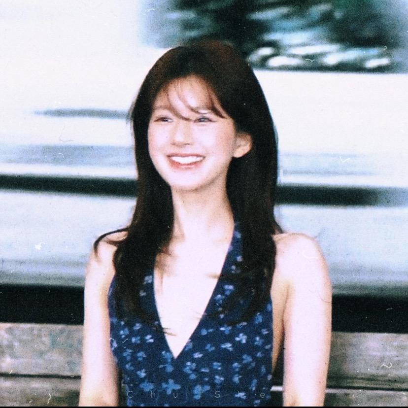 Smiling.