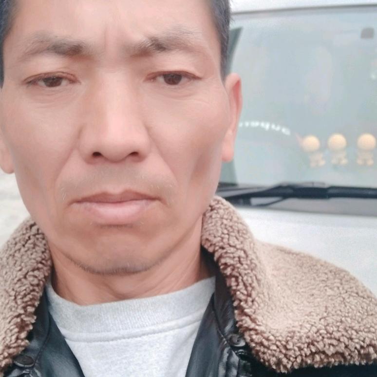 罗
