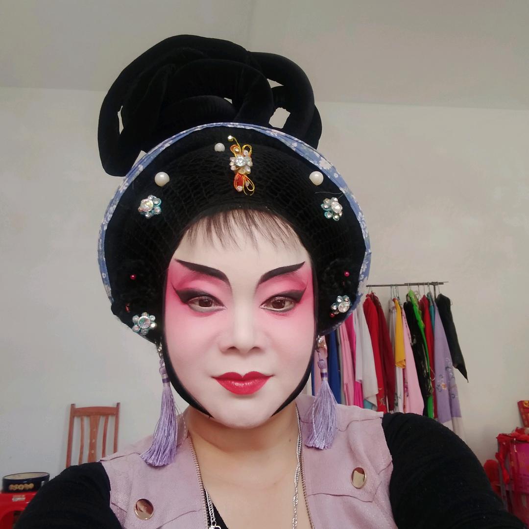 张倍容即是张丽