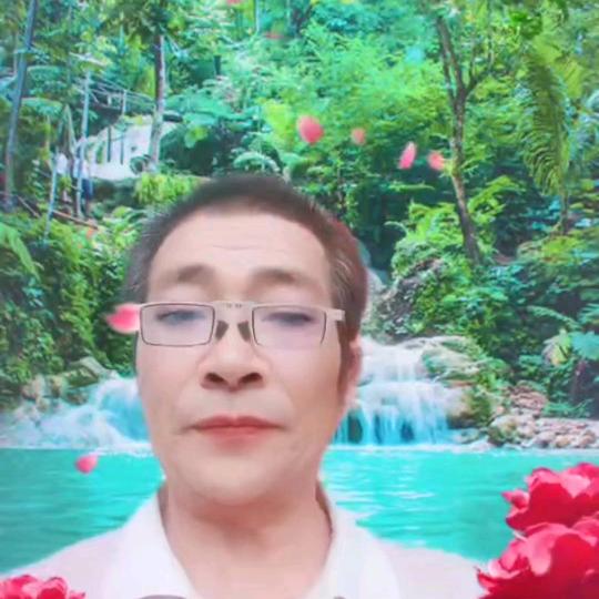 邱家根。
