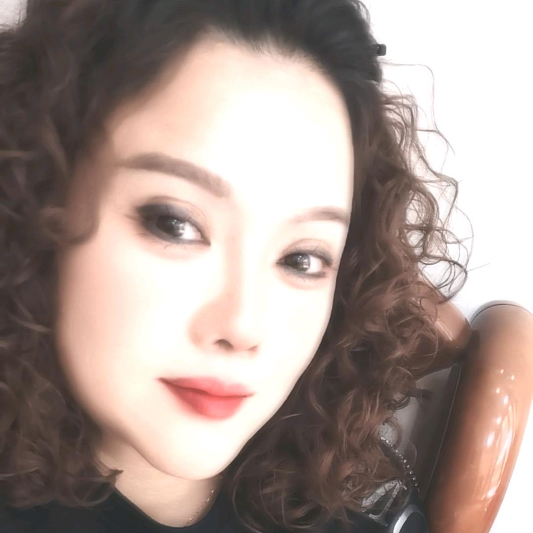 嫣然