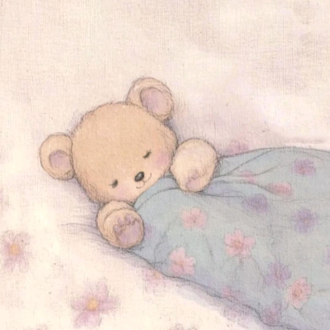 睡着了盖着蓝色被子的熊