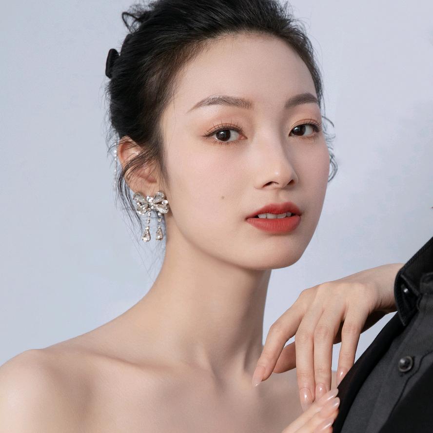 妩曌