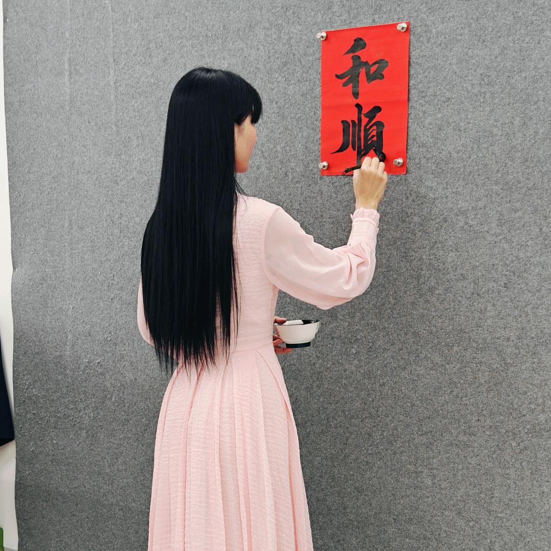 潘小鱼在学书（对联）