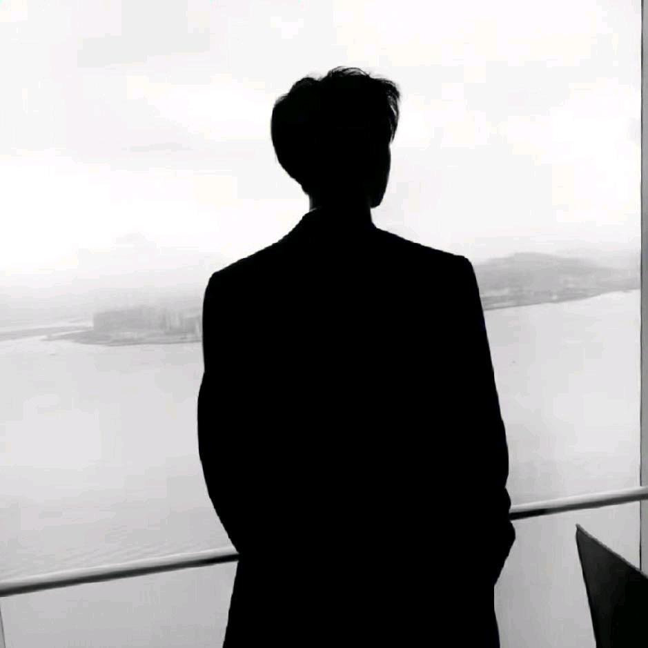 T.