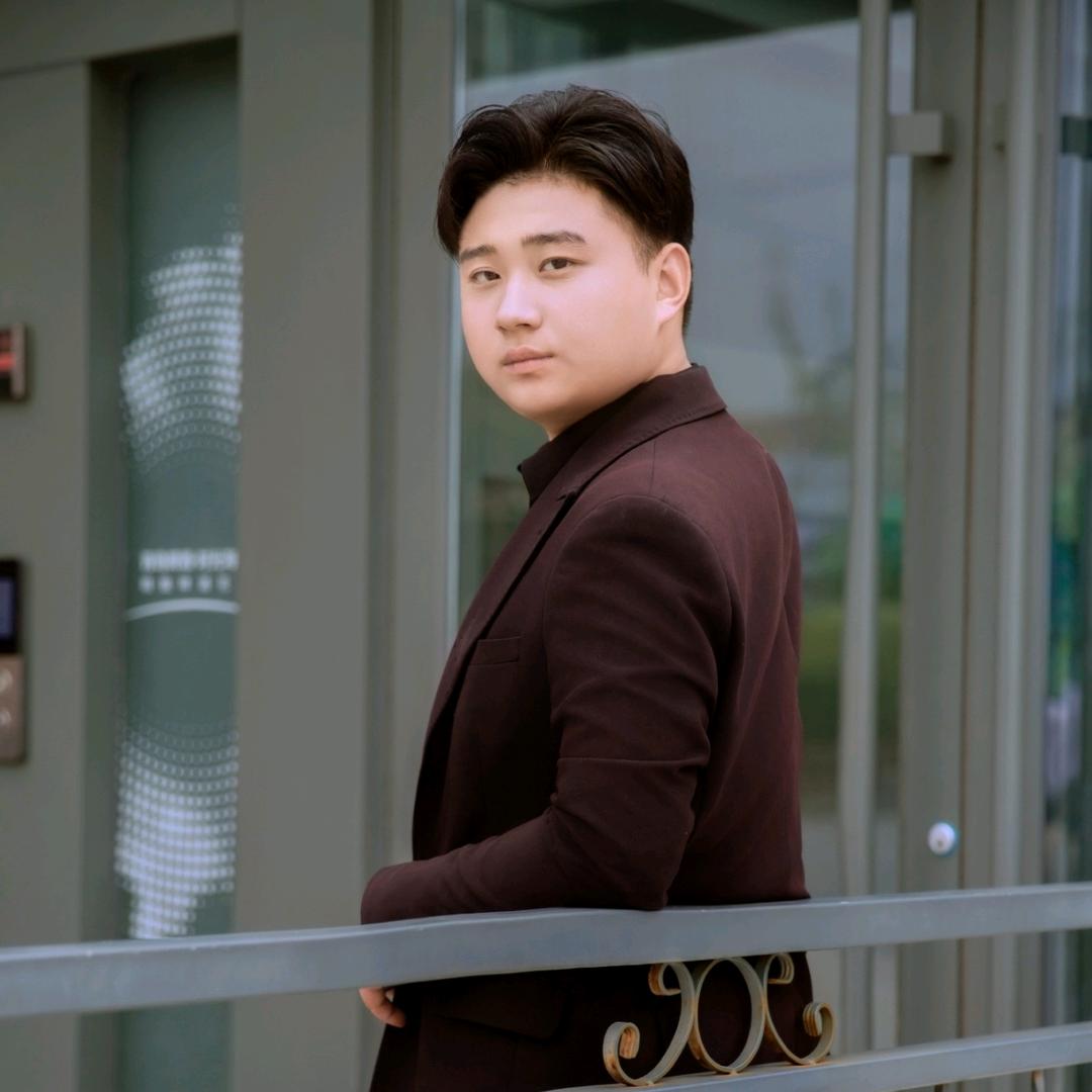 邓 哲