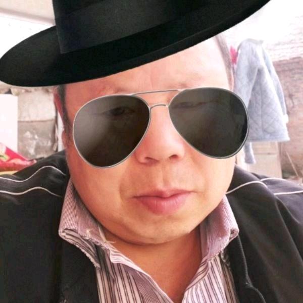 哥.-
