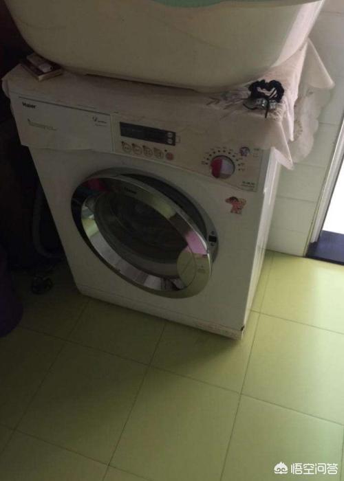 海尔全自动洗衣机洗衣中怎样把门打开，海尔全自动洗衣机怎么把门打开